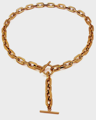 Gold chain bracelet with a clasp on a white background