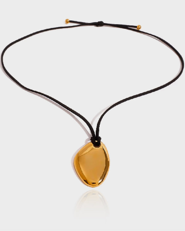 "Close-up of the Nirvana Necklace by Queen & Collection, showcasing its dual classic chain styles in premium 18K gold plating on stainless steel, highlighting its hypoallergenic and tarnish-resistant features."
