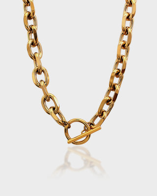 Gold chain necklace on a white background