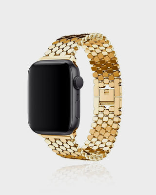 Smartwatch with a gold mesh band on a light gray background