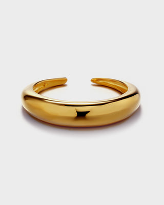 Gold bangle on a white background