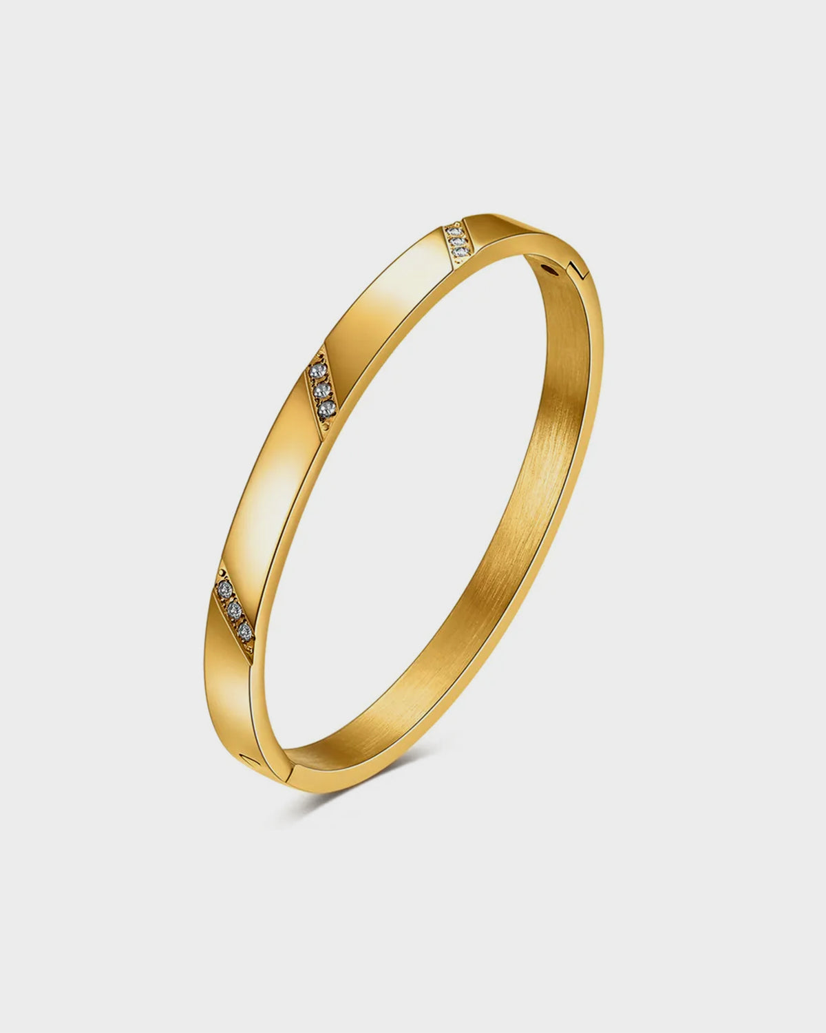 "Elegant gold Maya Bracelet from Queen and Collection, featuring a sleek and modern design with interlinked chain elements, perfect for adding a touch of sophistication to any outfit."