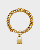 Gold chain bracelet with a padlock charm on a white background