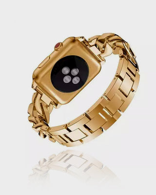 Gold metal watch band on a white background