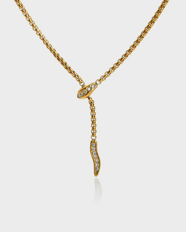 Gold necklace with a pendant on a white background