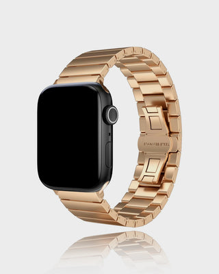 Smartwatch with a rose gold metal band on a light gray background