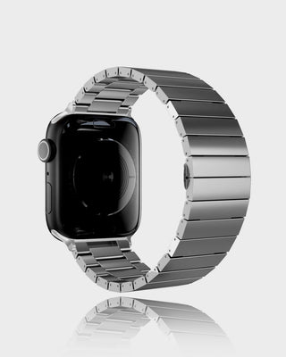 Smartwatch with a silver metal band on a light gray background