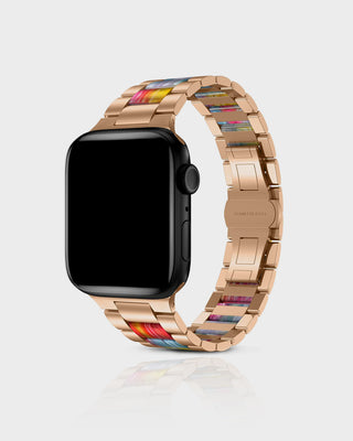 Smartwatch with a rose gold band featuring colorful accents on a light gray background