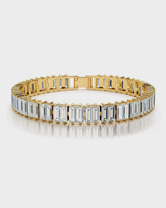 "Close-up of the Tennis Bold Bracelet, featuring a row of sparkling cubic zirconia stones set in a sleek, polished metal band. The bracelet has a classic tennis bracelet design with a secure clasp."