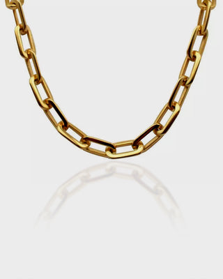 "Close-up of the Vertigo Necklace by Queen & Collection, featuring large rectangular links in polished 18K gold plating, measuring 47cm in length."


