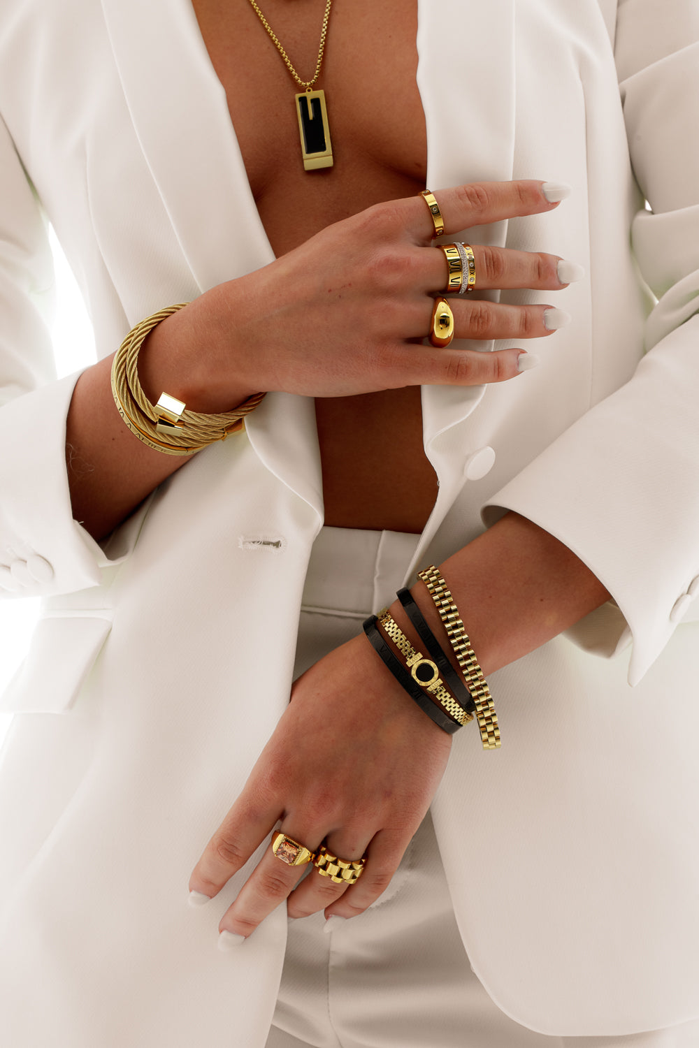 "Rope Layering Set featuring multiple intertwined bracelets with a textured rope design, designed for layering and styled in a chic, elegant arrangement."