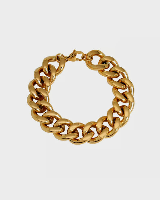 Queen Bracelet from Queen and Co., featuring a delicate, gold-toned design with intricate detailing, perfect for adding a touch of sophistication to any outfit.